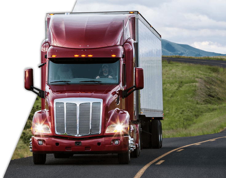 Man driving commercial truck on highway