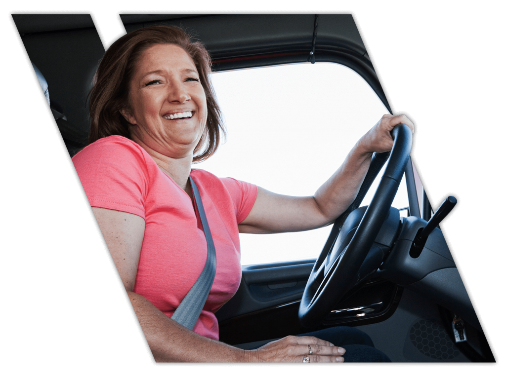 Female truck driving student doing on-the-road training