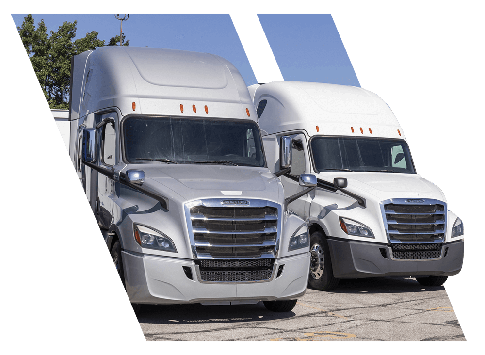 Two trucks in parking lot school for CDL license in New Orleans