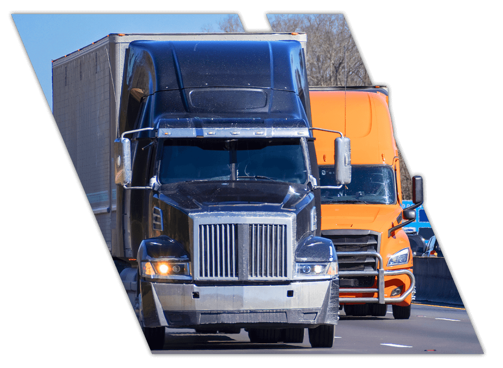 Black and orange truck on road from CDL school in Mississippi