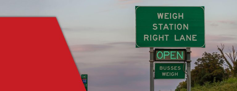 weigh station sign on interstate for checking trucking regulations