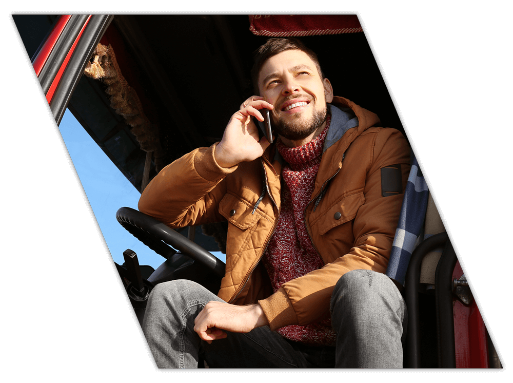 Excited driver on phone after driver training for businesses in Tennessee